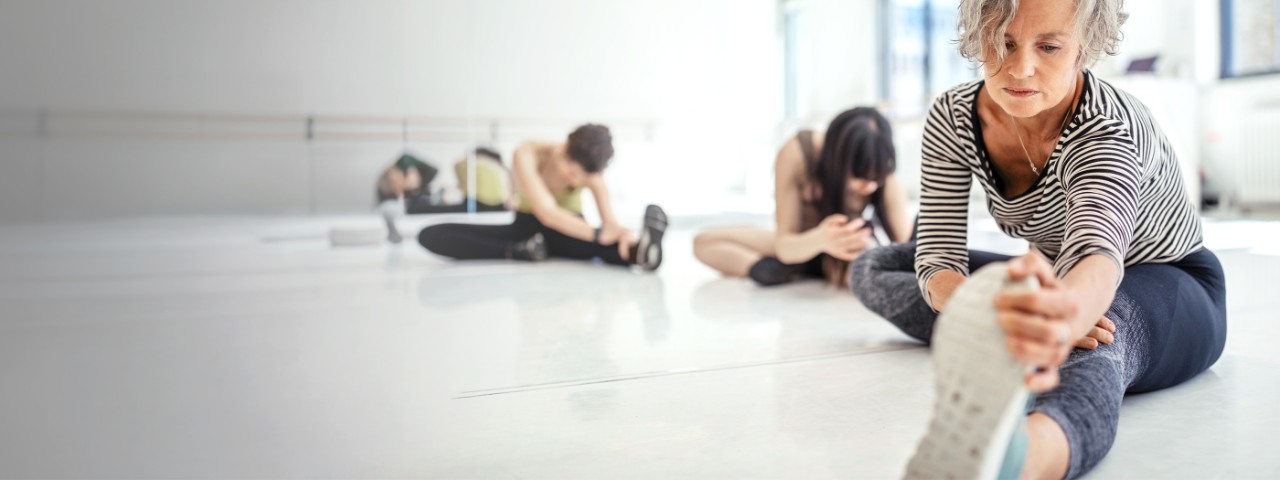 Women stretching in a fitness class.