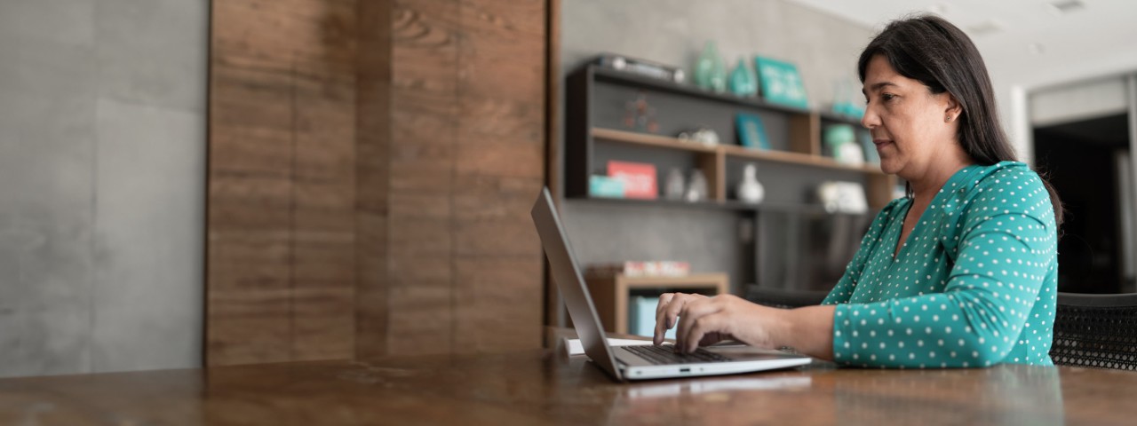 Woman typing on her laptop.