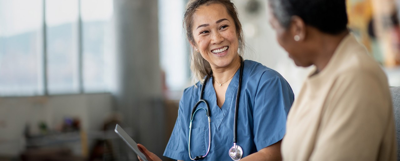 Female doctor talking to a female patient.